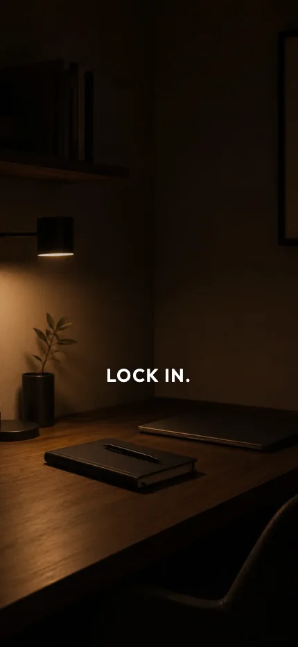 Study iPhone lock screen wallpaper with the words “lock in.” over a desk lamp photo